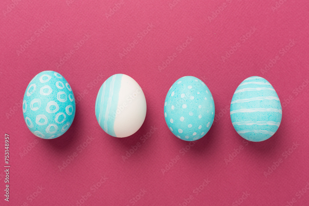 Blue easter eggs on color background, top view