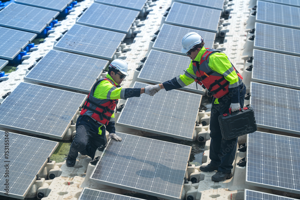 custom made wallpaper toronto digitalPhotovoltaic engineers work on floating photovoltaics. workers Inspect and repair the solar panel equipment floating on water. Engineer working setup Floating solar panels Platform system on the lake.