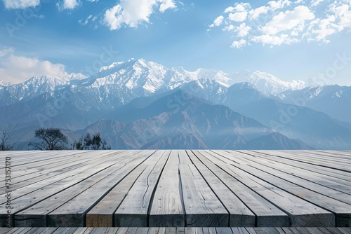 Elegant wooden platform with a backdrop of snow capped mountains offering a majestic setting for premium brands
