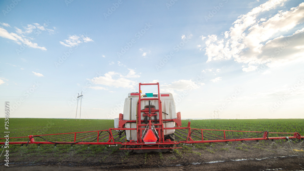 Fototapeta premium Spraying pesticides at soy bean fields
