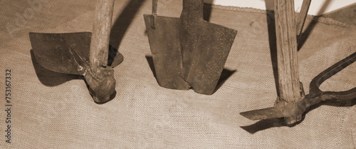 rusty agricultural tools used long ago by farmers with sepia antiqued effect