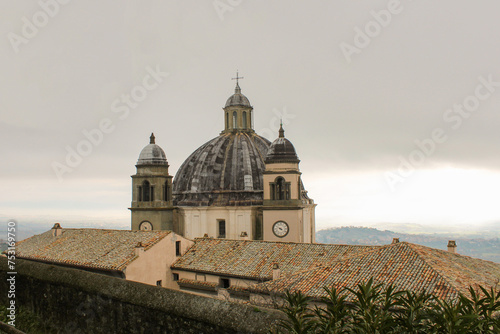Cupola e campanili con orologio della chiesa di Santa Margherita a Montefiascone con cielo nuvoloso photo