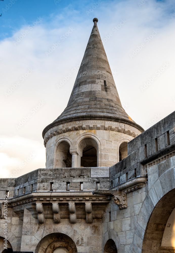 Stone towers of Fisherman`s Bastion, overlooking Budapest city and Danube river, Hungary Stone towers of Fisherman`s Bastion, overlooking Budapest city and Danube river, Hungary