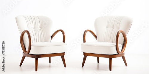 Art deco style armchairs in white velvet with wooden legs isolated on white background.