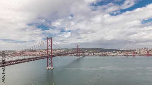 Panorama showing Lisbon cityscape and Tagus river timelapse with 25 of April bridge