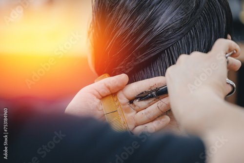 Concept banner Barbershop for man, sunlight. Closeup master hairdresser does hairstyle and style with scissors and comb