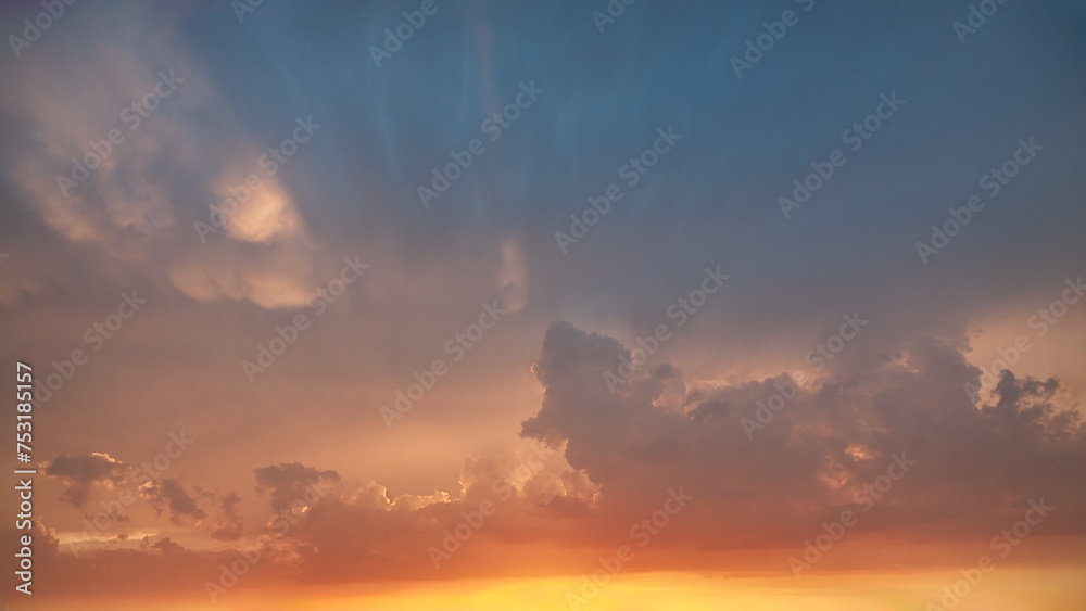 Colorful sky with clouds at romantic sunset as natural background