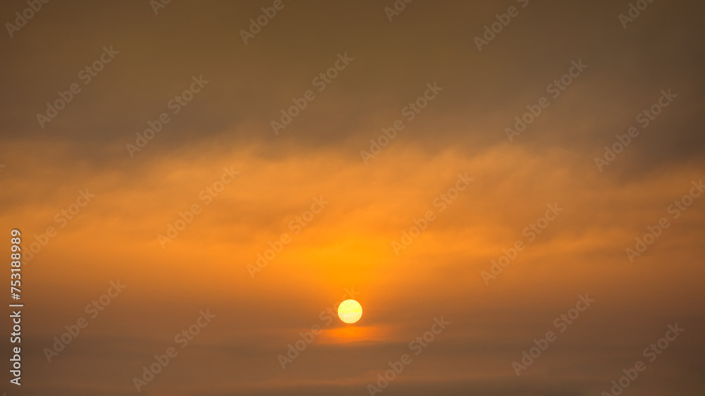 Painterly sky with sun and clouds at beautiful sunset as natural background