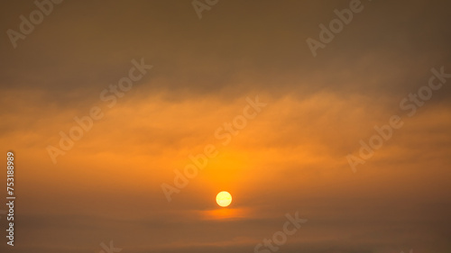 Painterly sky with sun and clouds at beautiful sunset as natural background