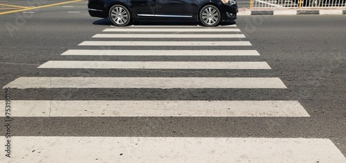 Car vehicle driver violating or not obeying traffic rules by stoping over zebra crossing sign lines Creating difficulty to pedestrians to cross the road. Reckless and irresponsible driving concept.