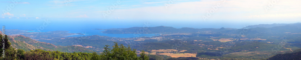 panoramic view of the eastern coast of Corsica, nicknamed the Isle of Beauty, from the charming belvedere village of Prunelli. We see a large part of the plain, the island of Elba and Montecristo.
