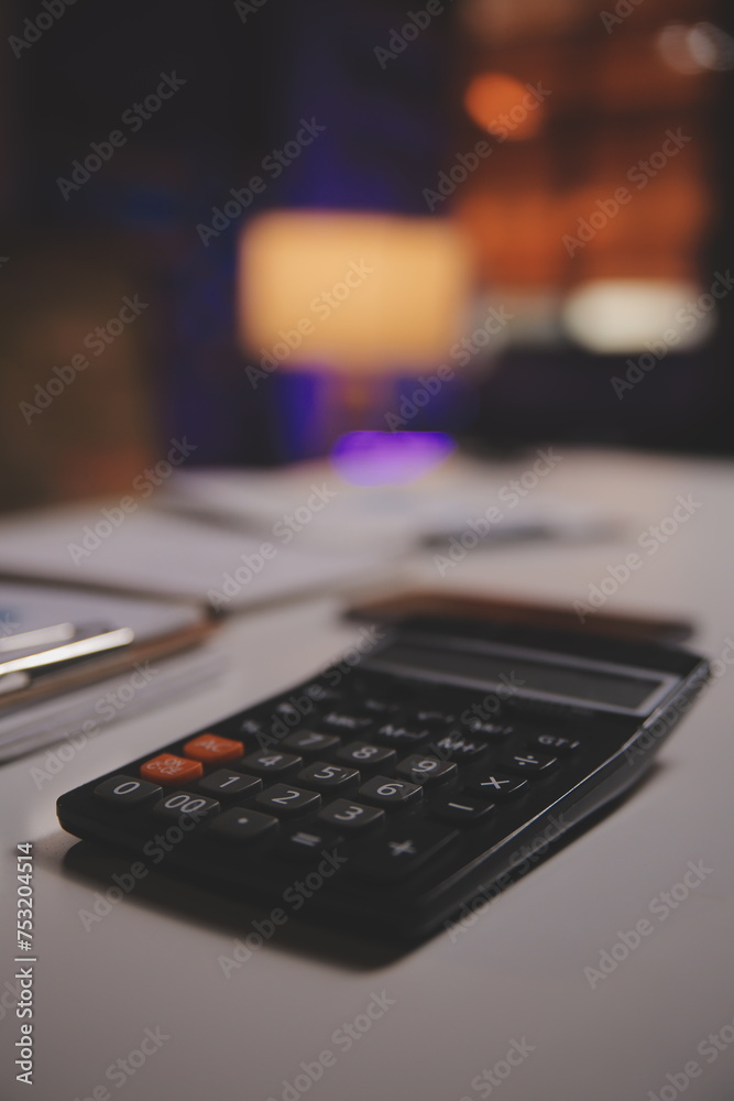 Business woman using calculator for do math finance on wooden desk in office and business working background, tax, accounting, statistics and analytic research concept Business woman using calculator for do math finance on wooden desk in office and business working background, tax, accounting, statistics and analytic research concept