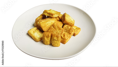 Fried tofu on a plate isolated on white background, yellow tofu or takwa tofu on a dining plate. 