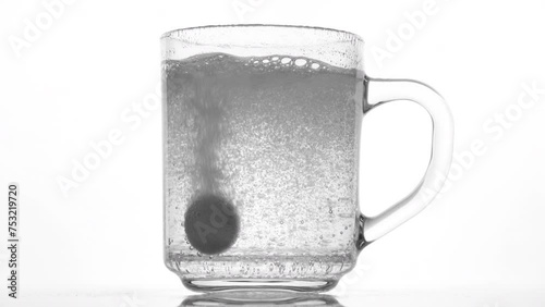 Effervescent tablet dissolve with bubbles in a glass of water