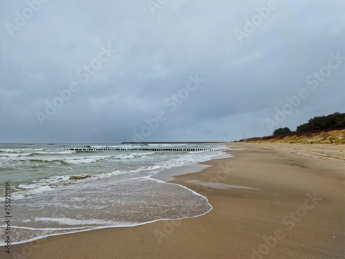 beach on the Baltic Sea near the dunes in Dziwnow, Poland photo