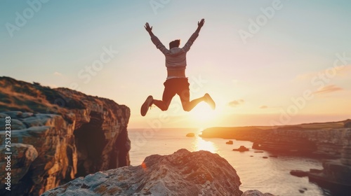 Man Jumping Off Cliff Into Ocean