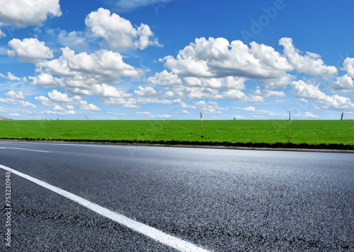abstract empty road in summer  blue sky  white clouds  highway or speedway in rural countryside created with generative ai technology