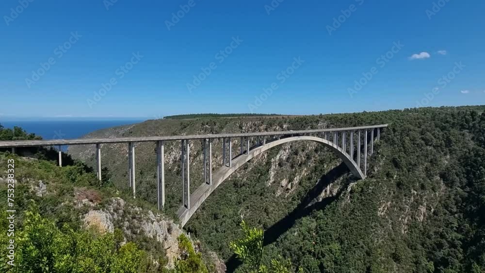 South Africa - Cars drive over the Bloukrans Bridge on a sunny day South Africa - Cars drive over the Bloukrans Bridge on a sunny day