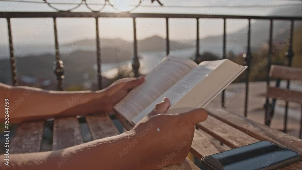 Close-up of a book in the hands of a man. Close-up of a book in the hands of a man.