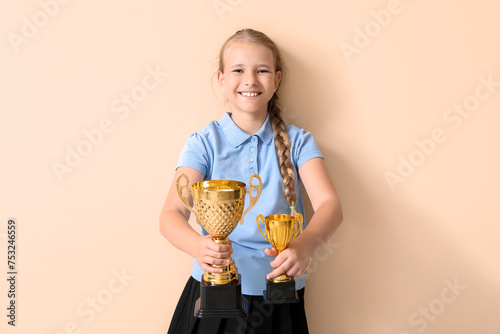 Cute little schoolgirl with...