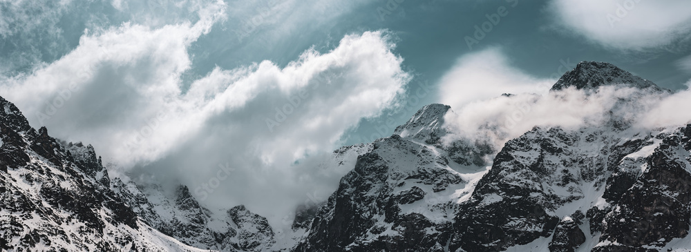 Mountain peaks near Morskie Oko or Sea Eye Lake in Poland at Winter. Tatras range - obrazy, fototapety, plakaty 