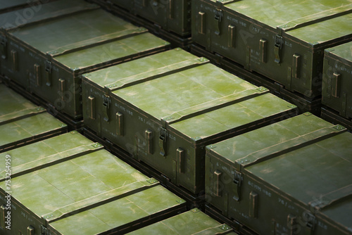 Olive Green Military Ammunition Boxes Neatly Stacked in Storage
