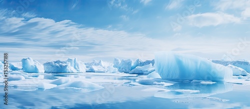 Majestic Iceberg Drifting in Vast Open Ocean Waters Under Clear Blue Sky