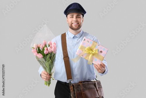 Handsome postman with tulip...