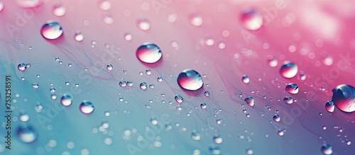 Vibrant Water Droplets Creating a Serene and Tranquil Pink and Blue Abstract Background