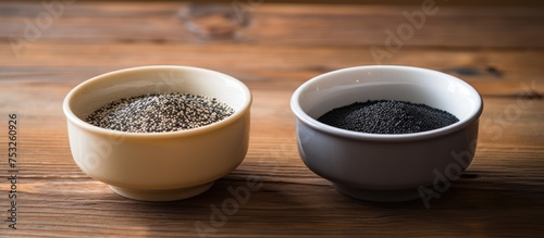 Rustic Composition with Two Cups Filled with Nutritious Chia Seeds on a Wooden Table photo
