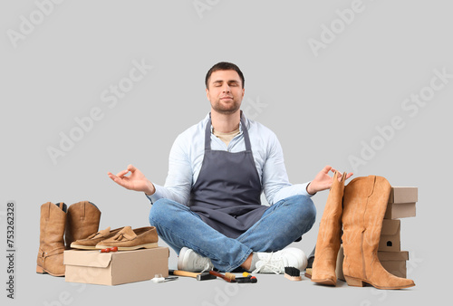 Male shoemaker with shoes m...
