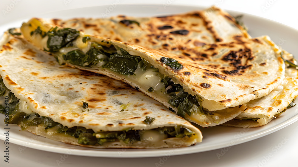 Spinach and cheese stuffed quesadilla on plate