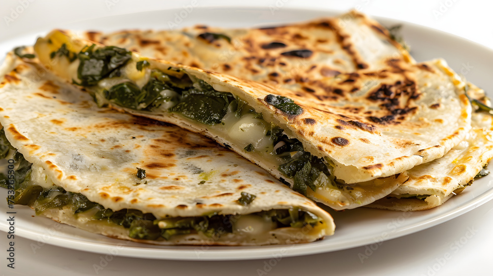 Spinach and cheese stuffed quesadilla on plate Spinach and cheese stuffed quesadilla on plate