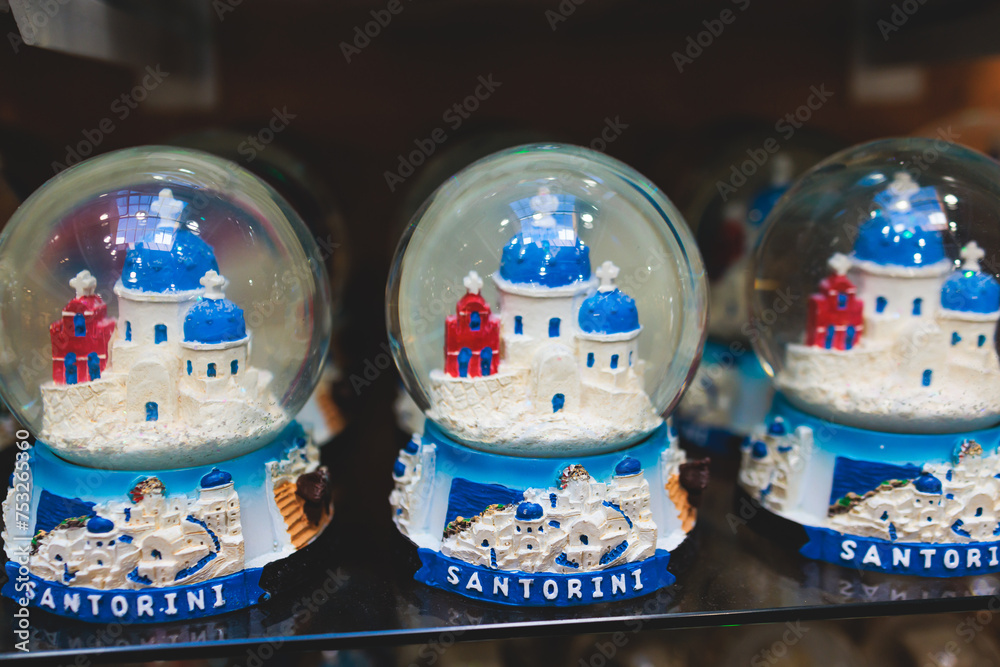 Traditional tourist souvenirs and gifts from Santorini island, Thira, South Aegean, Greece, fridge magnets with text 