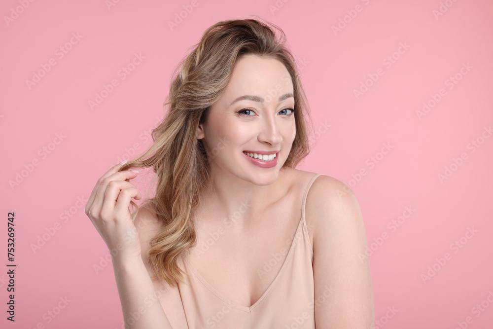 Portrait of smiling woman on pink background Portrait of smiling woman on pink background