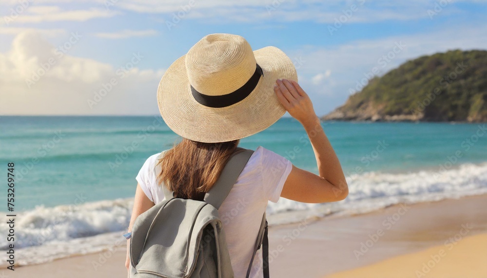 woman in hat looking on tropical beach