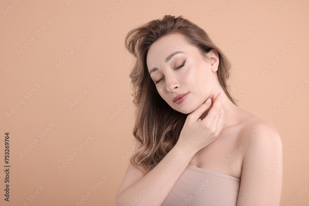 Portrait of beautiful woman on beige background. Space for text Portrait of beautiful woman on beige background. Space for text