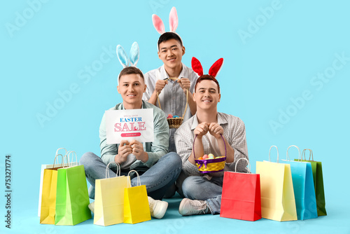 Young men in bunny ears wit...