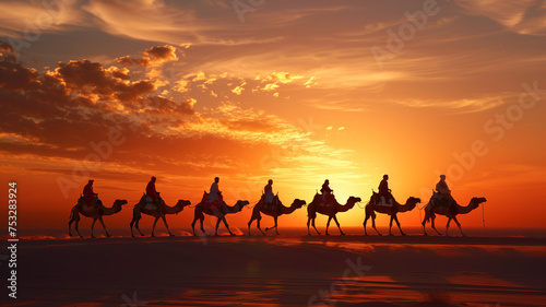 Caravan among the dunes. Silhouette of camels against the background of the setting sun in the desert.