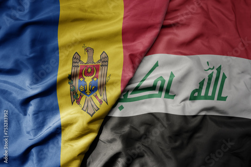 big waving national colorful flag of iraq and national flag of moldova .