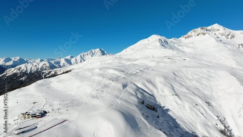 The ski area on the Motta Naluns mountain in Scuol, Switzerland on a sunny winter day. photo