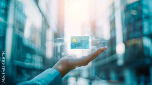
Light blue and white backdrop, modern business buildings. Confident businessman extends hand to camera. Above, holographic credit card icon symbolizes modern commerce. photo