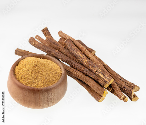 Glycyrrhiza glabra - Organic licorice powder and stems photo