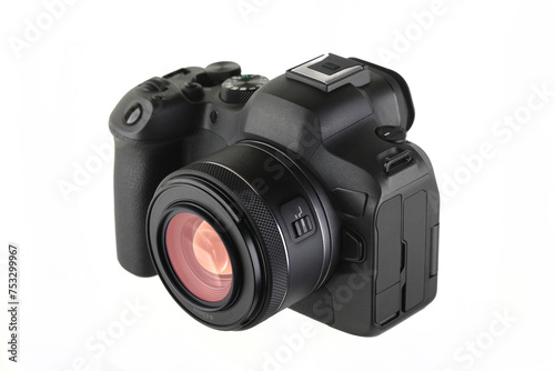 Modern digital mirrorless camera with Lens on a white background.