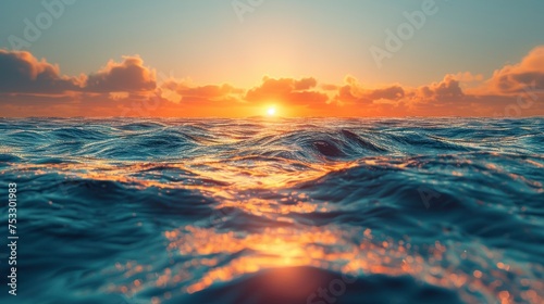 A sunset over the ocean with waves crashing on the shore and clouds over the ocean and beach