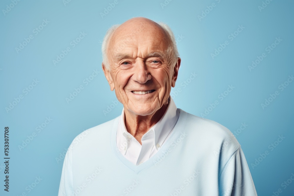 Portrait of a smiling senior man. Isolated on blue background. Portrait of a smiling senior man. Isolated on blue background.