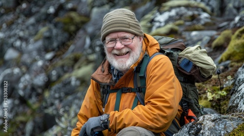 Elderly man smiling during a hike