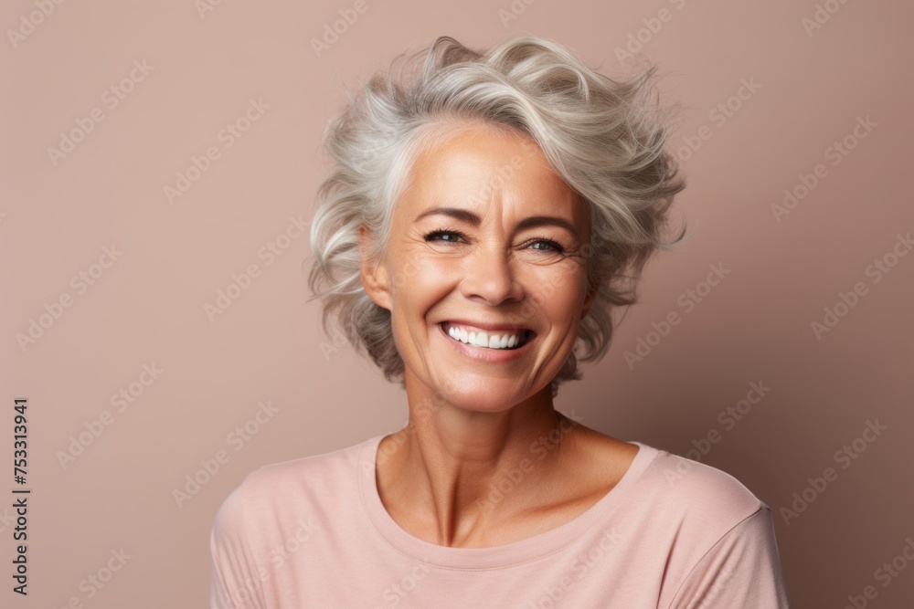 Portrait of a happy senior woman with grey hair and white smile. Portrait of a happy senior woman with grey hair and white smile.