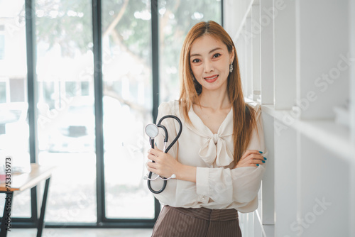 A confident healthcare professional stands poised in her clinic, stethoscope in hand, projecting a blend of competence and approachability essential in medical practice. Free Download A confident healthcare professional stands poised in her clinic, stethoscope in hand, projecting a blend of competence and approachability essential in medical practice. - GFXLoad
