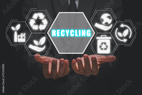 Recycling concept, Businessman hands holding recycling icon on virtual screen.